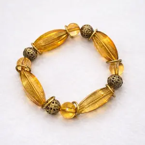 Golden Ember Charm Bracelet with Gold Color Accents and Yellow Beads for Women