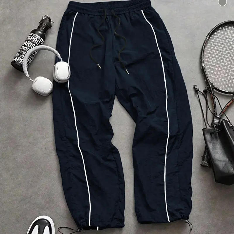 Men's lightweight casual fashion black sports pants with white stripes on the side, loose at the ankle, casual street style sports pants suitable for men and women couples, daily/street style, loose fit, windproof design