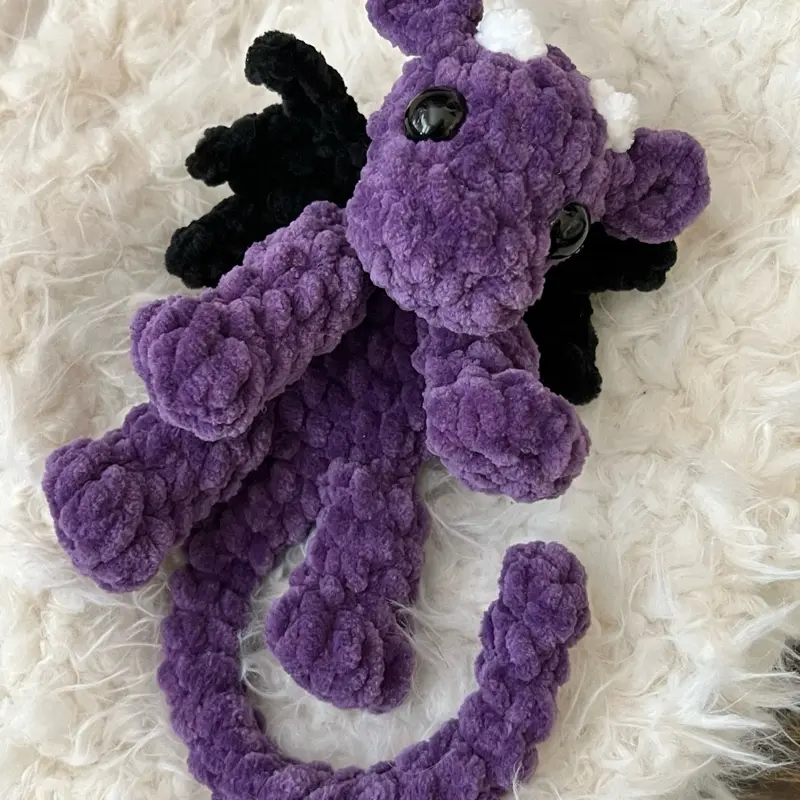 Crocheted Purple Baby Plush Toy with Black and White Features Crocheted Purple Baby Plush Toy with Black and White Features