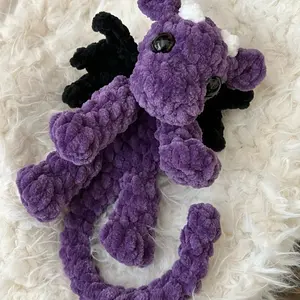 Crocheted Purple Baby Plush Toy with Black and White Features