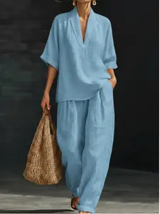 Women’s summer short-sleeve set: a V-neck top that is simple and elegant, paired with loose pants with pockets for comfort and a casual feel—the complete outfit is stylish and versatile.