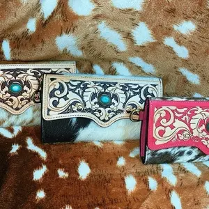 Hand tooled leather and cowhide wallets