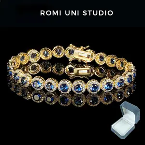 Romi Uni Studio Blue/Green Round Tennis Bracelet, suitable for both men and women, features 5mm cubic zirconia gemstones, comes with a gift box, and is available in lengths of 6.5-8 inches. A classic and sparkling piece of jewelry.