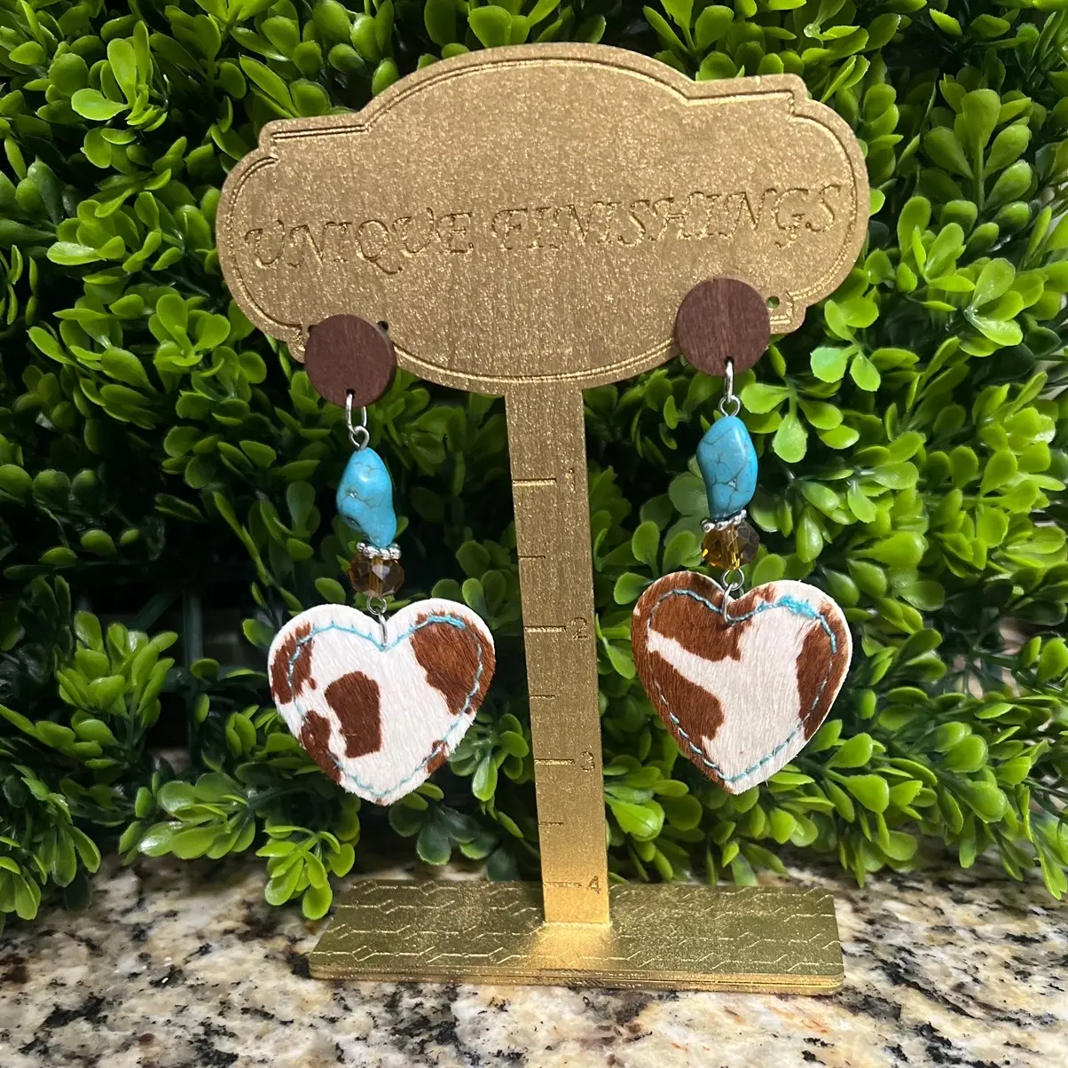 Pretty cowhide earrings with turquoise accents Female