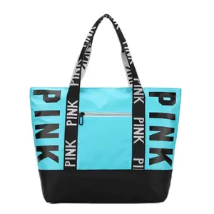 PINK Large Tote Bag with Bold Logo Design and Durable Handles for Everyday Use in Vibrant Aqua and Black