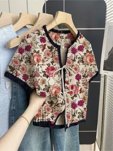 Women's khaki bohemian vacation short-sleeve knit top. Loose round neck, contrast floral print, front tie and contrast piping. Comfortable for spring & summer casual wear. Casual Boho Soft
