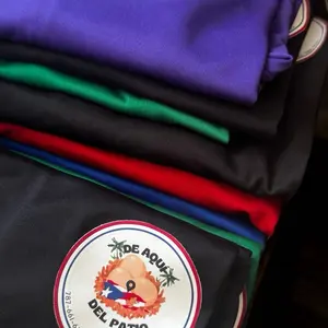 Custom Design T-Shirts in Polyester or Cotton - Available in Various Colors with Unique Logo Patch