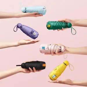 Women's UPF 50 Plus UV Protection Travel Umbrella Compact Mini Pocket Portable Foldable Capsule Umbrella Lighter Combo Moisturizing Gel Spa Socks