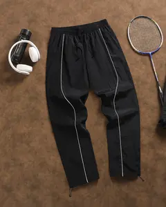 Men’s track pants with white stripes, elastic waistband and drawstring hem, lightweight and breathable—perfect for the gym, running, casual wear, and street style.