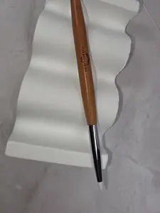 Double-ended brush for 3D nail art designs.