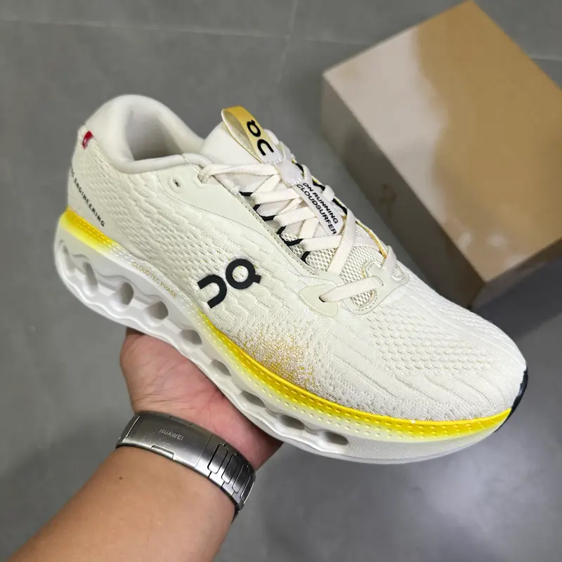 Cream yellow two-tone hollow cushioned low-top running trainers featuring scuff-proof pale rubber outsoles, tear-resistant sweat-wicking stretch knit mesh construction, mesh embedded airflow cutouts, wavy hollow lightweight foam midsole layout