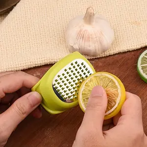 A Compact Grilling Tool for The Kitchen, This Manual Grinder for Ginger And Garlic Is a Sturdy Utensil for Shredding Food And Grilling. It'S a Versatile Handheld Kitchen Gadget That'S Easy to Carry, Making It Perfect for Camping