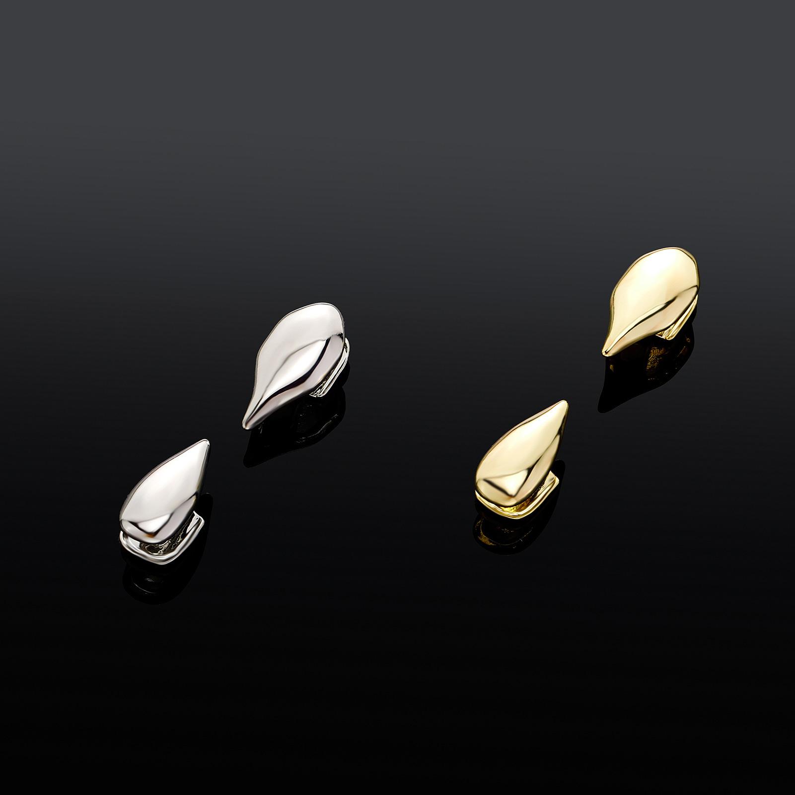 New personality and fashion selling fangs and fangs in Europe and America Halloween funny explosions small tiger teeth wild braces for men and women exquisite daily fashion accessories.