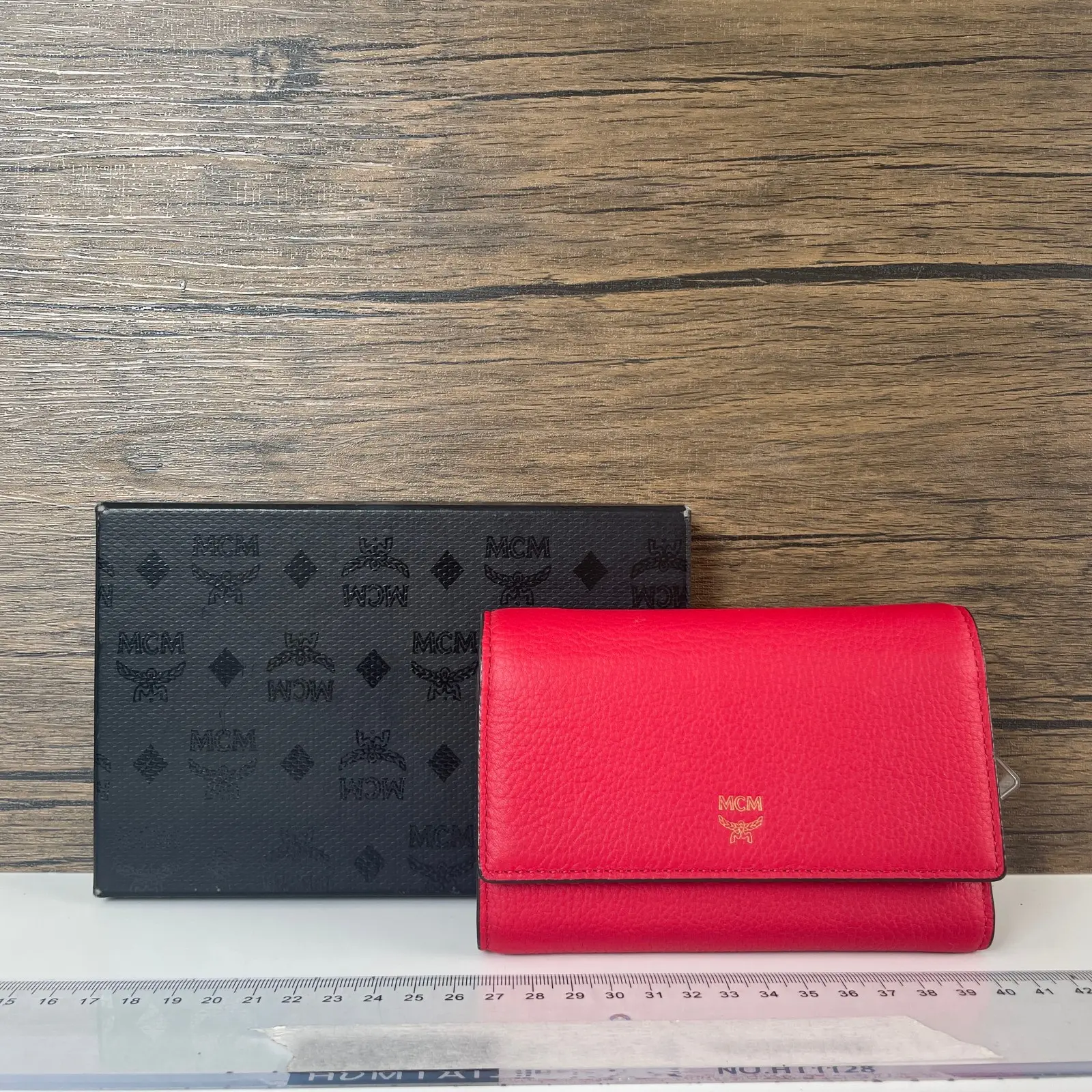 Pre-owned MCM Leather Mini bags red pebbled compact wallet, gold logo emblem, snap closure, includes original box.+bag chain+++