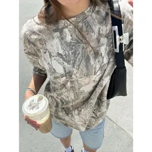Women’s retro street-style off-shoulder T-shirt with a withered maple leaf camouflage print, loose fit and crew neckline; summer casual streetwear GARMENTARY