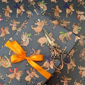 Dancing reindeer Christmas wrapping paper, fun and quirky gift wrap.