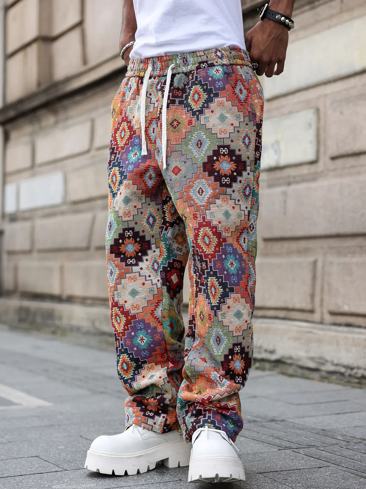 Timeless classic ethnic tapestry long trousers for men, straight fit, geometric pocketed design; elastic waistband with an integrated system; rich tribal woven texture and subtle side pockets; comfortable, structured silhouette for everyday casual wear.