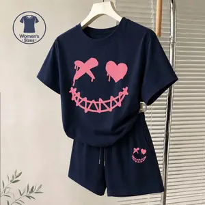 Women's Pink Smiling Face Graphic Short Sleeve T-Shirt And Shorts Set, Casual Summer Two-Piece Outfit With Crew Neck Top And Drawstring Waist Shorts For Daily Wear