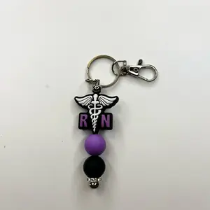 Cute Trendy RN Registered Nurse Keychain with Purple and Black Silicone Beads Beaded Bar Measures 3-1/2 Inches Long