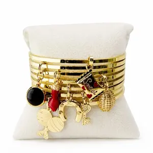 Semanario de Elegua Oro Laminado Inspirado en Eguá Figura Espiritual de la Tradición Yoruba Representa Movimiento Decisiones y Nuevos Comienzos Charms Bracelet Charm Bracelets Boho Style Bangles