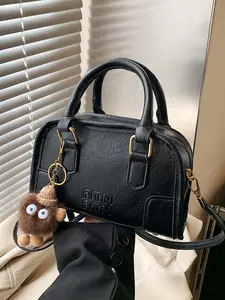 Simple classic retro Boston handbag, Casual trendy handbag, paired with a cartoon pompom pendant, casual, versatile, crossbody bag, available in a variety of colors, niche design suitable for daily commuting, shopping, etc.