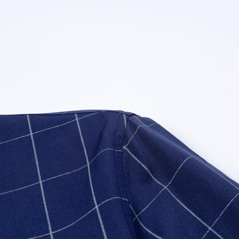 Men’s long-sleeve shirt with four plaid color-block panels, business-casual style. Button-down notched collar design for a sharp look, red buttons add refined details, blue-and-white plaid interior provides visual depth. Long-sleeve fit suitable for multi