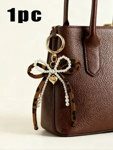 Leopard Bow Bag Charm Keychain, Purse Accessories, Charms For Bags, Pearl Bow Beaded Decoration With Gold Love Pendant, Light Gold Round Spring Buckle Design, An Elegant Metal Accessory Suitable For Backpacks, Wallets, And Phone Cas