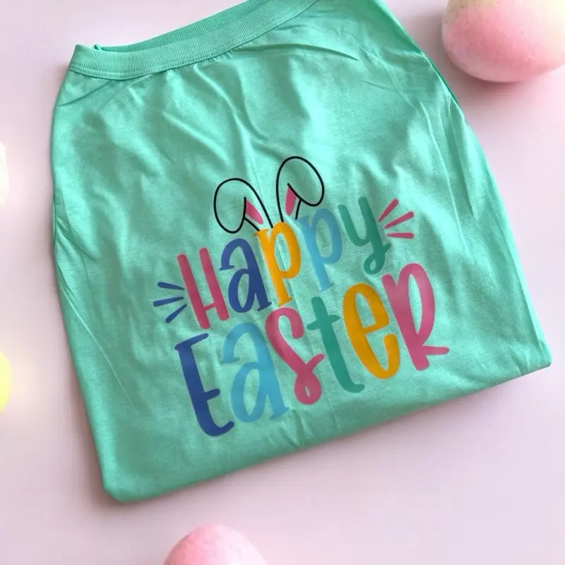 Happy Easter Dog T-Shirt - Light Teal, Light Pink and White with Colorful "Happy Easter" Text, Soft Fabric, Fun and Celebratory Design