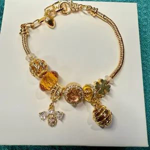 Brand New Rose Gold Bee Honeycomb Bracelet with Sparkling Charms and Elegant Design