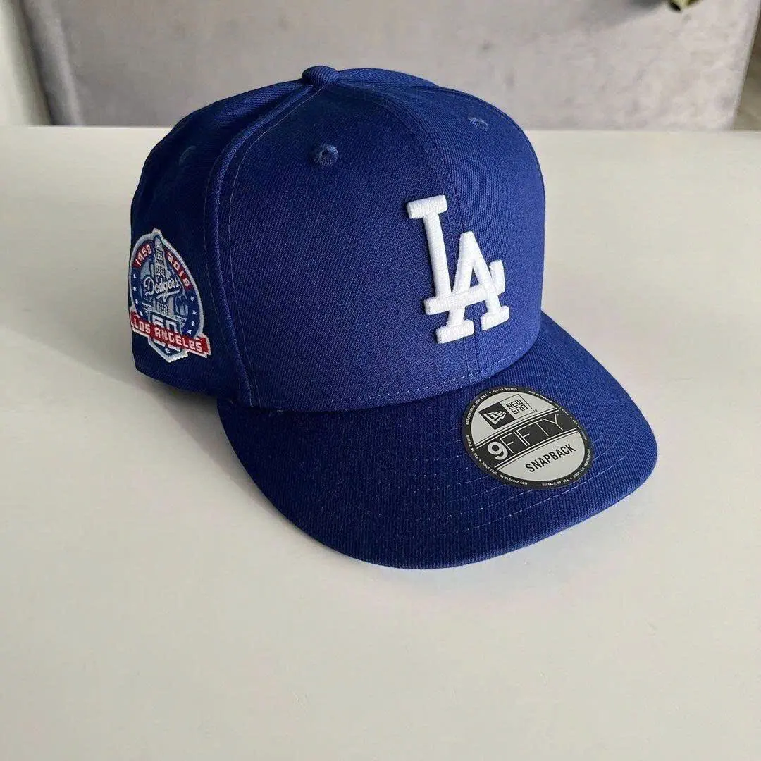 New Era 9FIFTY Los Angeles Dodgers Adjustable Snapback Hat for Men & Women – Royal Blue Flat Brim Baseball Cap with White Embroidered LA Logo, 50th Anniversary Side Patch, Everyday Streetwear Sports Hat