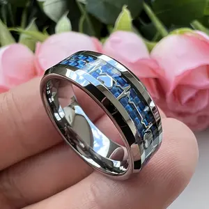 Popular European and American stainless steel couple rings with heartbeat and carbon fiber design, wholesale, blue background electrocardiogram