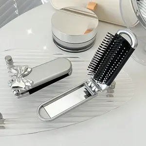 1Pc Portable Comb: Compact and travel-friendly, featuring an air-cushioned hand mirror and cushion-style comb, ideal for ladies’ everyday use and travel