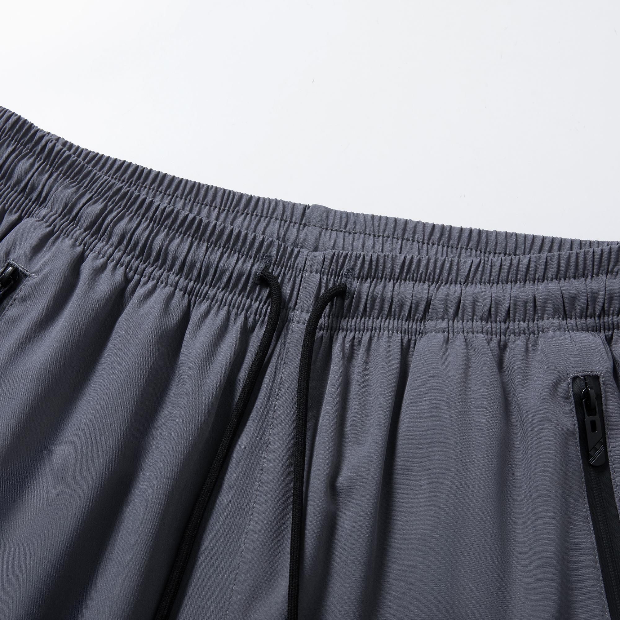 Men’s lightweight jogger pants with stretch fabric, 95% polyester, 5% spandex; elastic waistband with zippered pockets; breathable, quick-drying casual bottoms; men’s sports-casual jogger pants; machine washable.