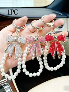 Personalized, fashionable, practical, and elegant hanging accessories, with a bow and pearl wristband, can be used as bag hanging accessories and keychains. It is a niche, delicate, gentle and atmospheric pendant