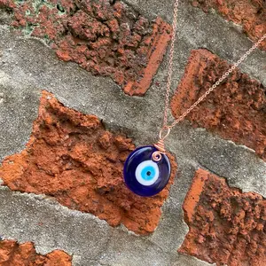 Copper hand wrapped evil eye necklace for protection