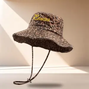 A Customizable Embroidered Name Fisherman'S Hat, Featuring a Leopard Print esign, Made from Soft Fabric, Equipped with a Windproof Cord, And Allows for Personalized Text