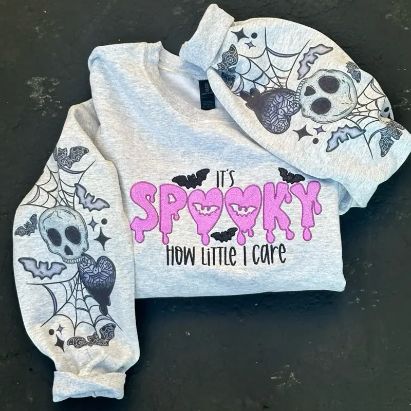 Women's Spooky "How Little I Care" Pullover Sweatshirt - Soft Cotton-Polyester Blend, Glitter HTV, Sublimated Sleeves, Embroidered Design, Custom Appliqué, Everyday Wear