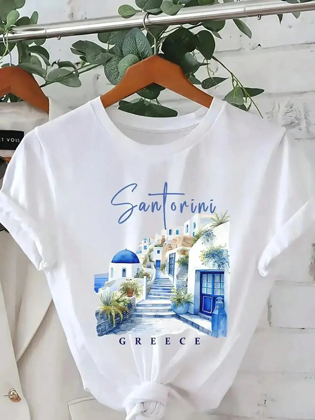 Women's Santorini Greece Pattern Printed T-Shirt - White Short Sleeve Casual Crew Neck Top, With Blue Domed Roofs And Lush Greenery Design, Lightweight Spring/Summer Travel Souvenir, Single's Party Gift, Spring Casual Wear |   Vibrant Graphic Tee