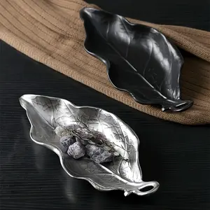 A Ceramic Modern Decorative Tray In The Shape Of A Leaf For Bedroom Tabletop Decoration, Storing Rings, Necklaces, Earrings, Keys At The Entrance, Soap Dish In The Bathroom, And As An Aromatherapy Tray. Available In Black/Silvery. A Delicat Plates Home