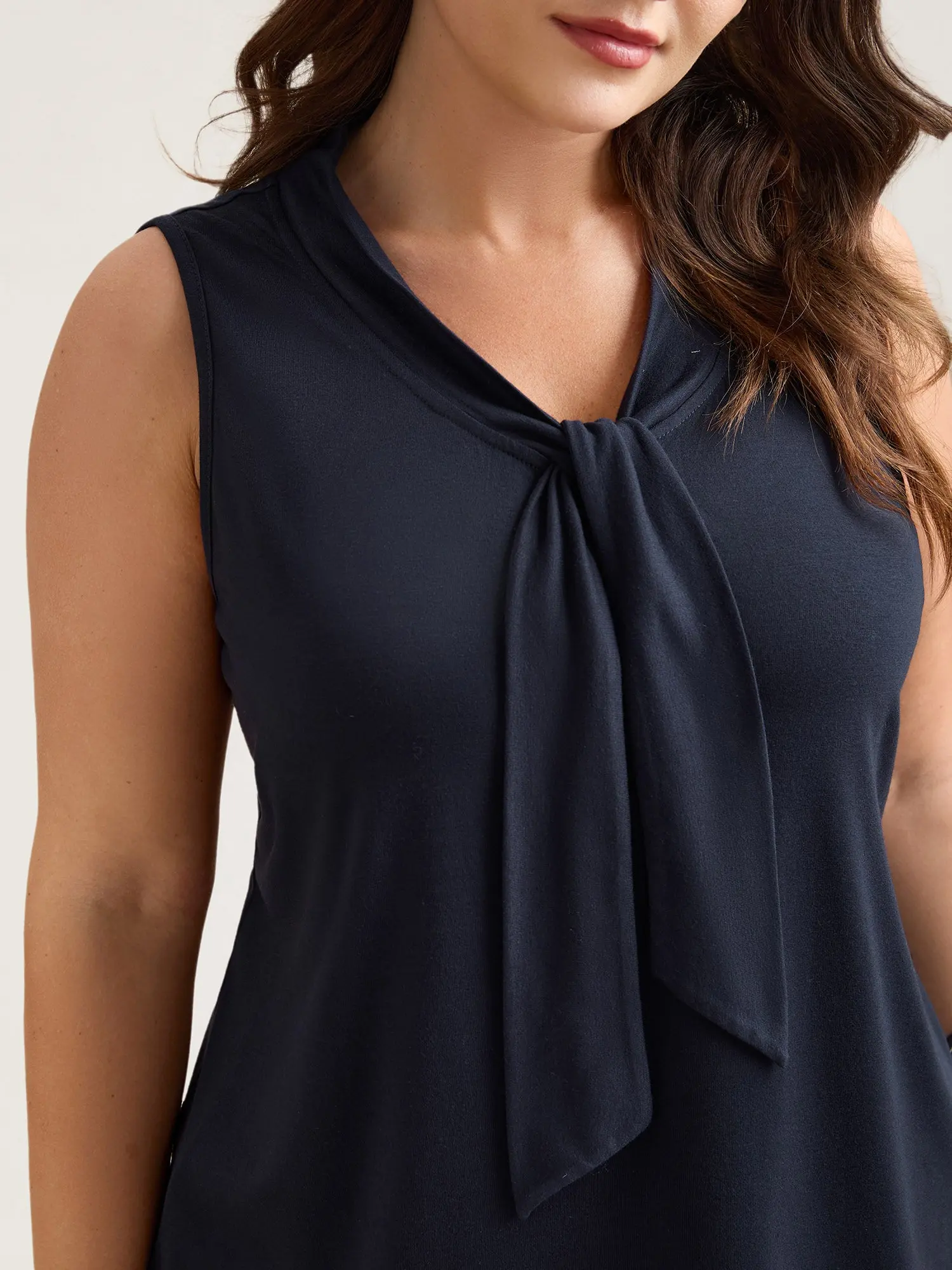 BloomChic Women's Plus Size Tie-Neck Sleeveless Blouse, Solid Indigo Minimalist Top for Business Office, Low Iron Spandex Fabric