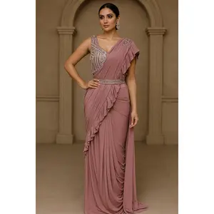 Elegantly designed deep pastel pink saree with hand made blouse and belt