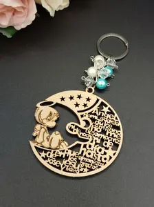 US 12pcs Angel Boy in the Moon Design Laser Cutout Wooden Keychain Baptism Favors with Boy Angel Recuerdos de Bautizo With Organza Bags