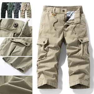 100% cotton tactical cargo pants with multiple pockets, buttoned flap pockets with fabric tabs, orange drawstring waist, seven-eighths straight cut, abrasion-resistant mid-length shorts
