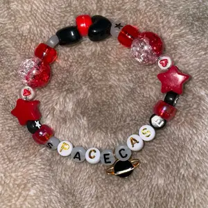 space case red and black kandi bracelet with planet charm