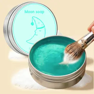 Moon-Shaped Makeup Brush Cleansing Bar—a cleaning tool for makeup sponges and brushes. This portable cleansing bar features a coconut scent and provides a deep clean without leaving any residue.