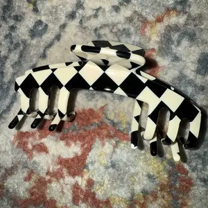 The Kacee Checkered Black and White Hair Clip with a Bold, Retro Vibe for a Vibrant Look Designed for Adjustable Hats