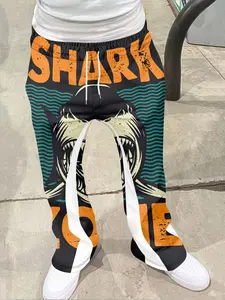 1 pair of shark themed street style casual Fitted pants, paired with the word "SHARK", with black, orange, and green as the main colors, featuring a retro vintage texture. The pants are infused with wave patterns, adding a trendy street vibe, Geometric