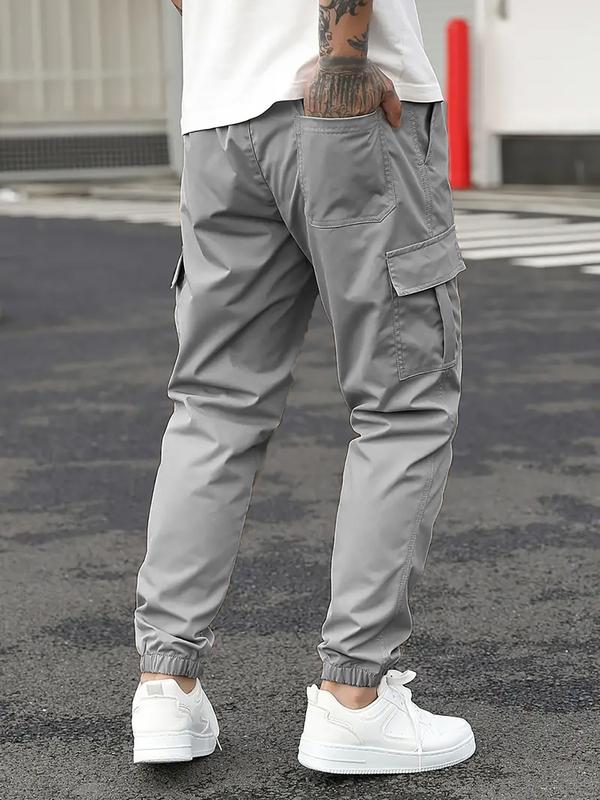 Men's durable work pants with multiple pockets; outdoor sports pants; cargo pants with drawstring design; tapered men's pants; machine washable; holiday gift.
