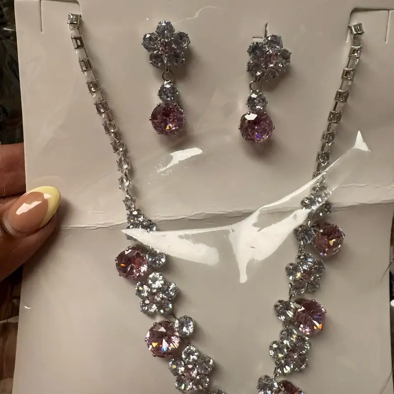 Silver-tone rhinestone necklace with blush pink crystal accents and matching