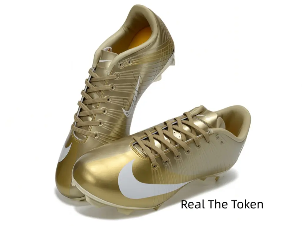 English: Luxurious all-metallic gold soccer cleats with iconic white logo detailing, ribbed textured upper enhances ball grip, integrated molded studs provide steady traction for high-intensity grass match sprints and turns.